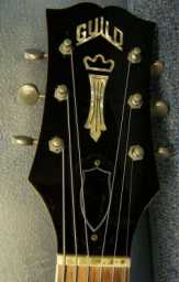 Guild T-100 1963 sunburst w-newer Guild case headstock.jpg